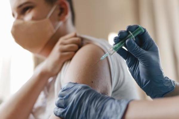 Left or right left or right doctor giving kid vaccine while wearing gloves
